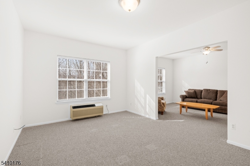 4 Richmond Road West Milford, NJ 07480 - Photo 10 of 25 an empty room with couch and wooden floor