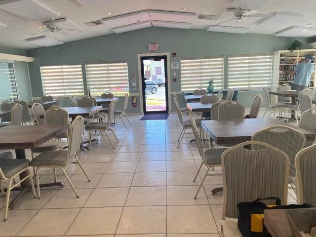 a dining room with furniture and window