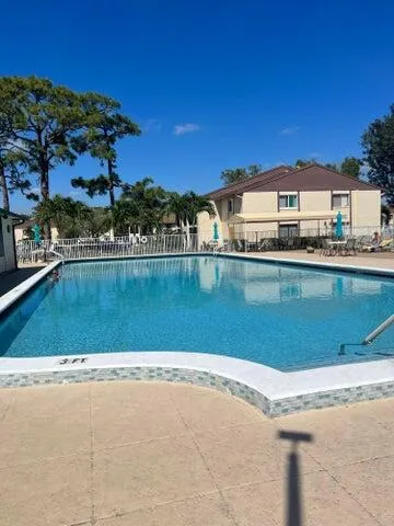 a view of a swimming pool and an outdoor space