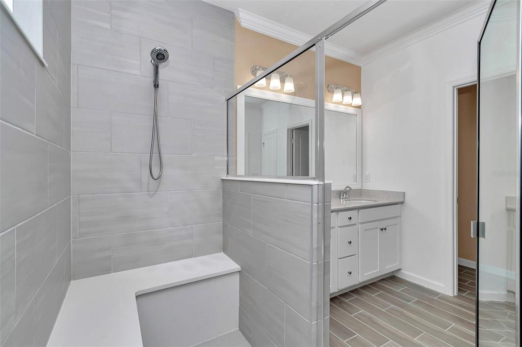 7867 Southwest 74th Loop Ocala, FL 34481 - Photo 47 of 55 a bathroom with a sink a toilet and shower