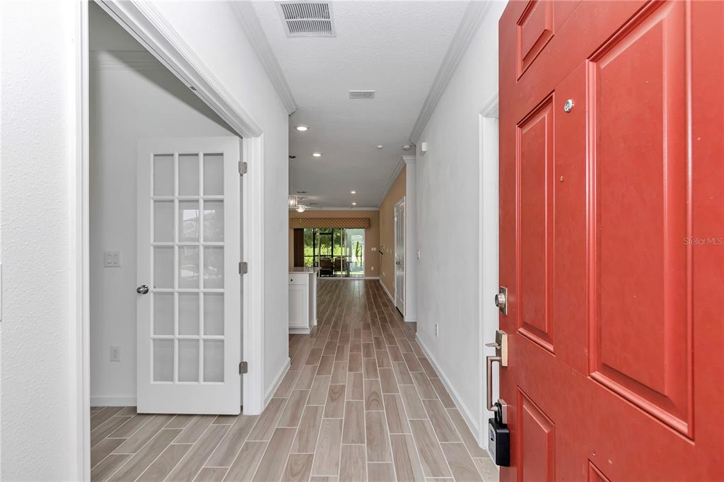 7867 Southwest 74th Loop Ocala, FL 34481 - Photo 7 of 55 a view of hallway with wooden floor