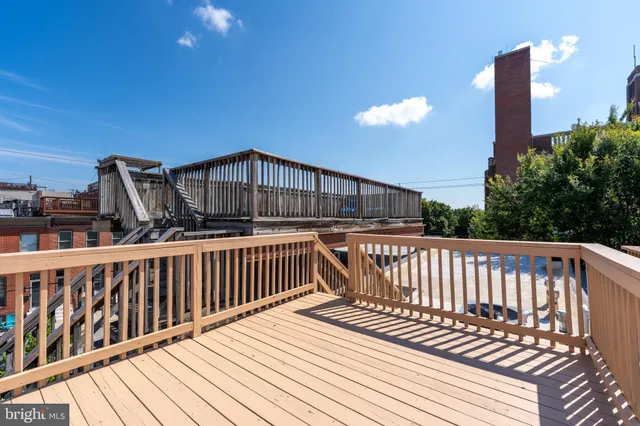 a view of balcony with wooden floor