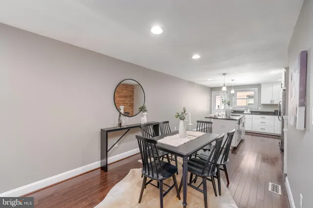 a view of a dining room with furniture and a window