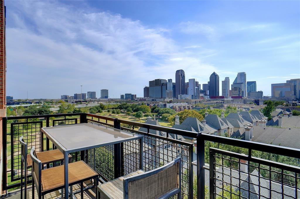 3110 Thomas Avenue, Unit 739 Dallas, TX 75204 - Photo 2 of 18 a view of a chairs and table on the terrace