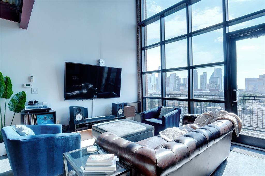 3110 Thomas Avenue, Unit 739 Dallas, TX 75204 - Photo 3 of 18 a living room with furniture and a flat screen tv