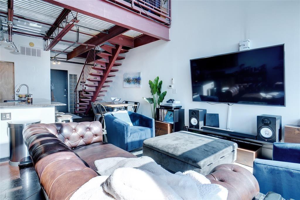 3110 Thomas Avenue, Unit 739 Dallas, TX 75204 - Photo 6 of 18 a living room with furniture and a flat screen tv