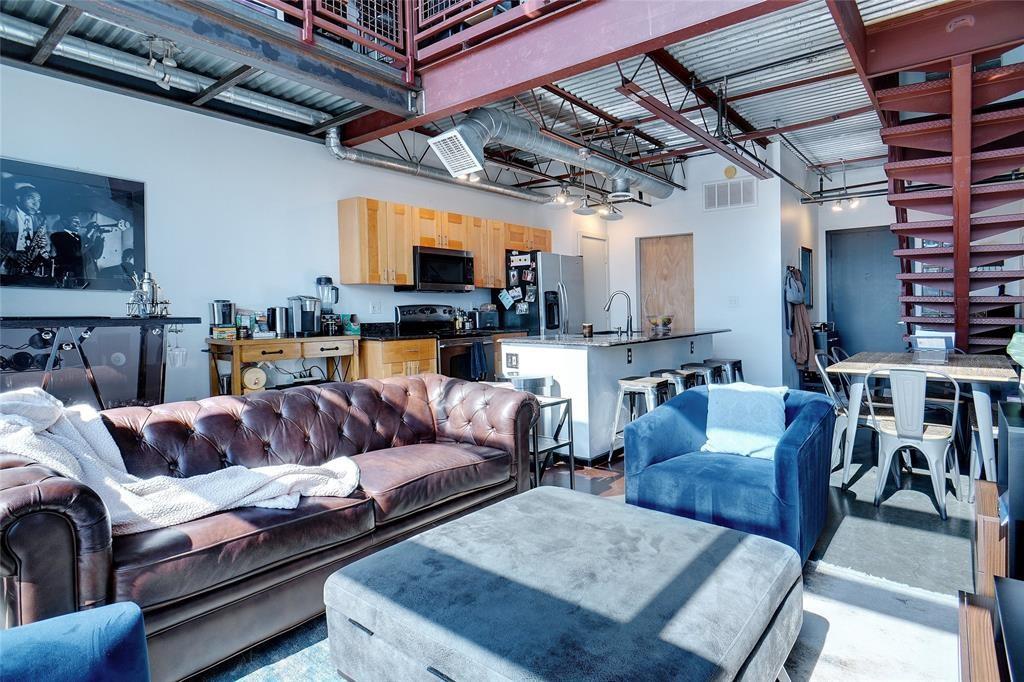 3110 Thomas Avenue, Unit 739 Dallas, TX 75204 - Photo 7 of 18 a living room with furniture and a flat screen tv