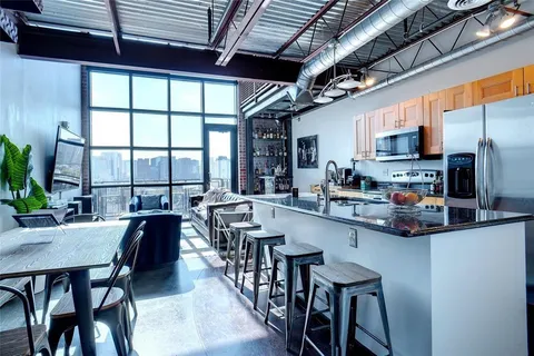 a outdoor living space with furniture and a fireplace