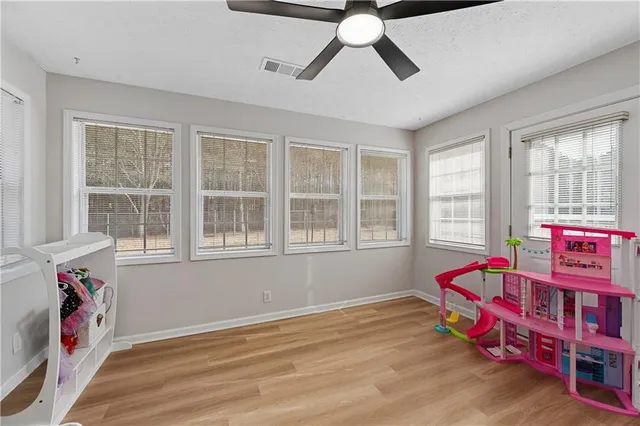 a bedroom with furniture and a window