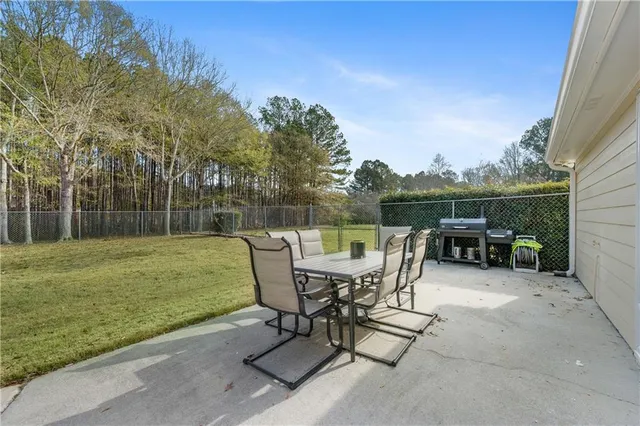 a view of a table and chairs on the roof deck