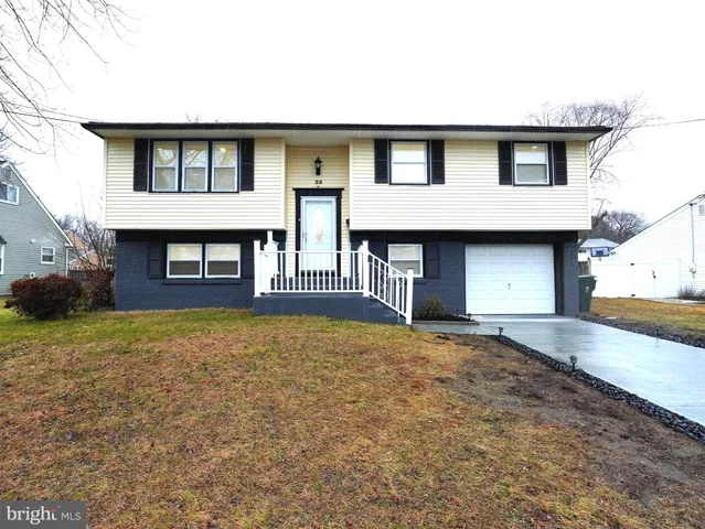 a kitchen with sink a stove and cabinets