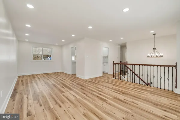 a view of wooden floor in an empty room