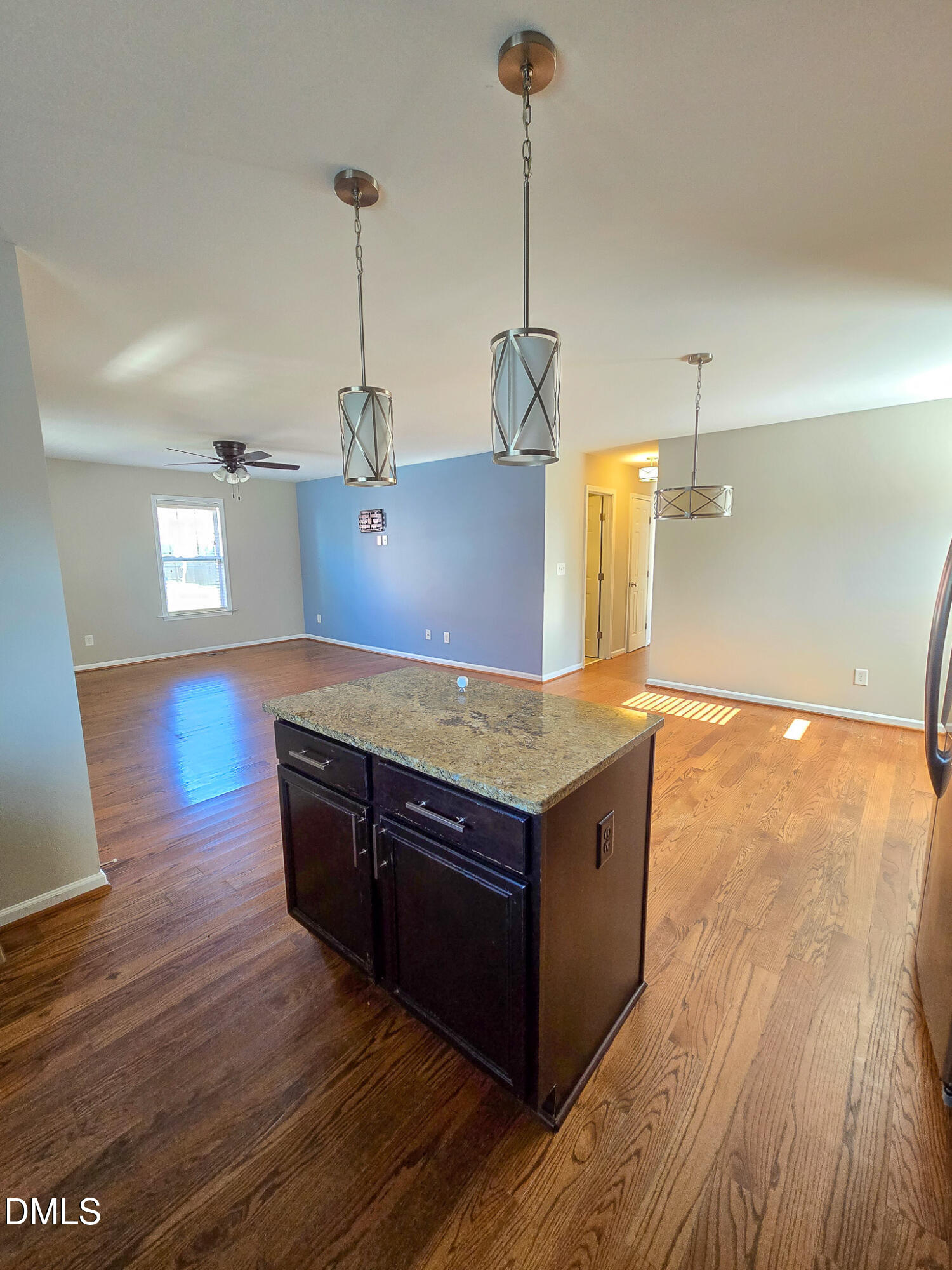 1133 South State Street Raleigh, NC 27601 - Photo 11 of 34 a kitchen with stainless steel appliances granite countertop white cabinets a stove top oven and wooden floor