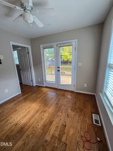 wooden floor and window in an empty room