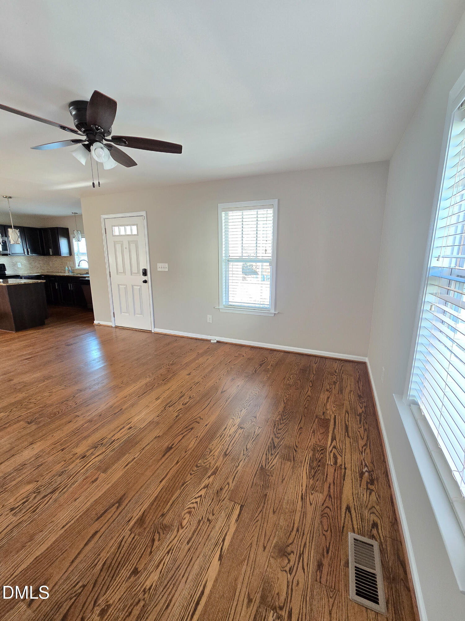 1133 South State Street Raleigh, NC 27601 - Photo 5 of 34 a view of empty room with wooden floor and fan