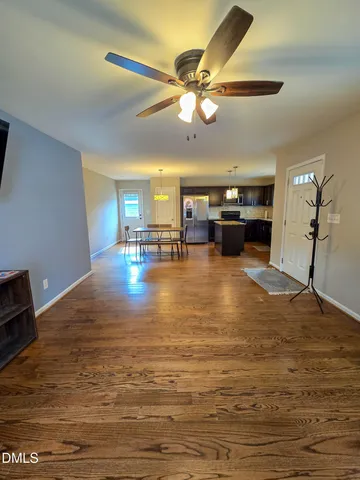 a view of a kitchen with a stove cabinets and a wooden floor