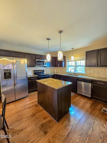 a kitchen with stainless steel appliances granite countertop a sink counter space and stainless steel appliances