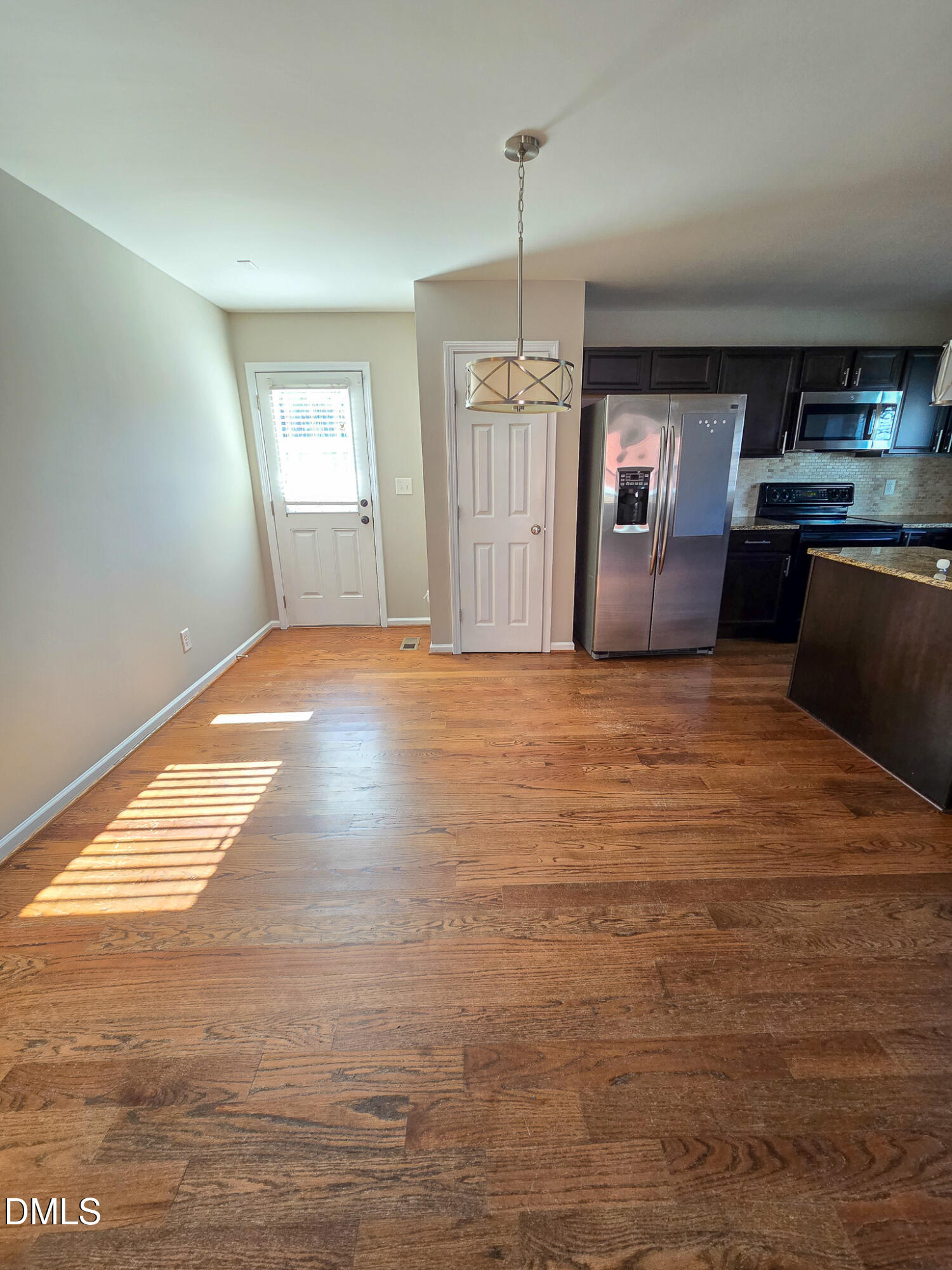 1133 South State Street Raleigh, NC 27601 - Photo 7 of 34 a view of a kitchen with cabinets and wooden floor