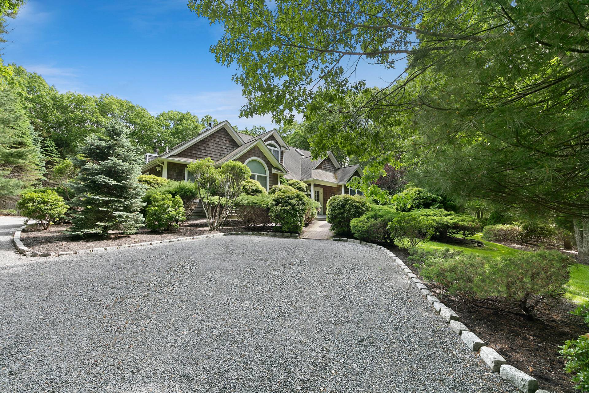 1557 Millstone Road Sag Harbor, NY 11963 - Photo 12 of 12 a view of a garden with potted plants