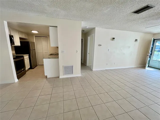 a view of a kitchen with furniture and cabinets
