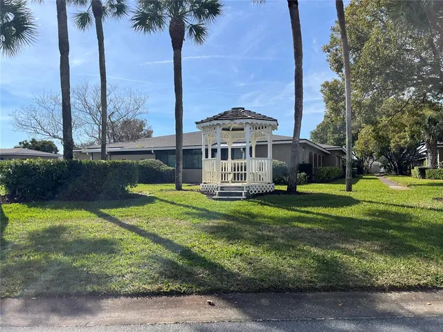 a view of a backyard of the house