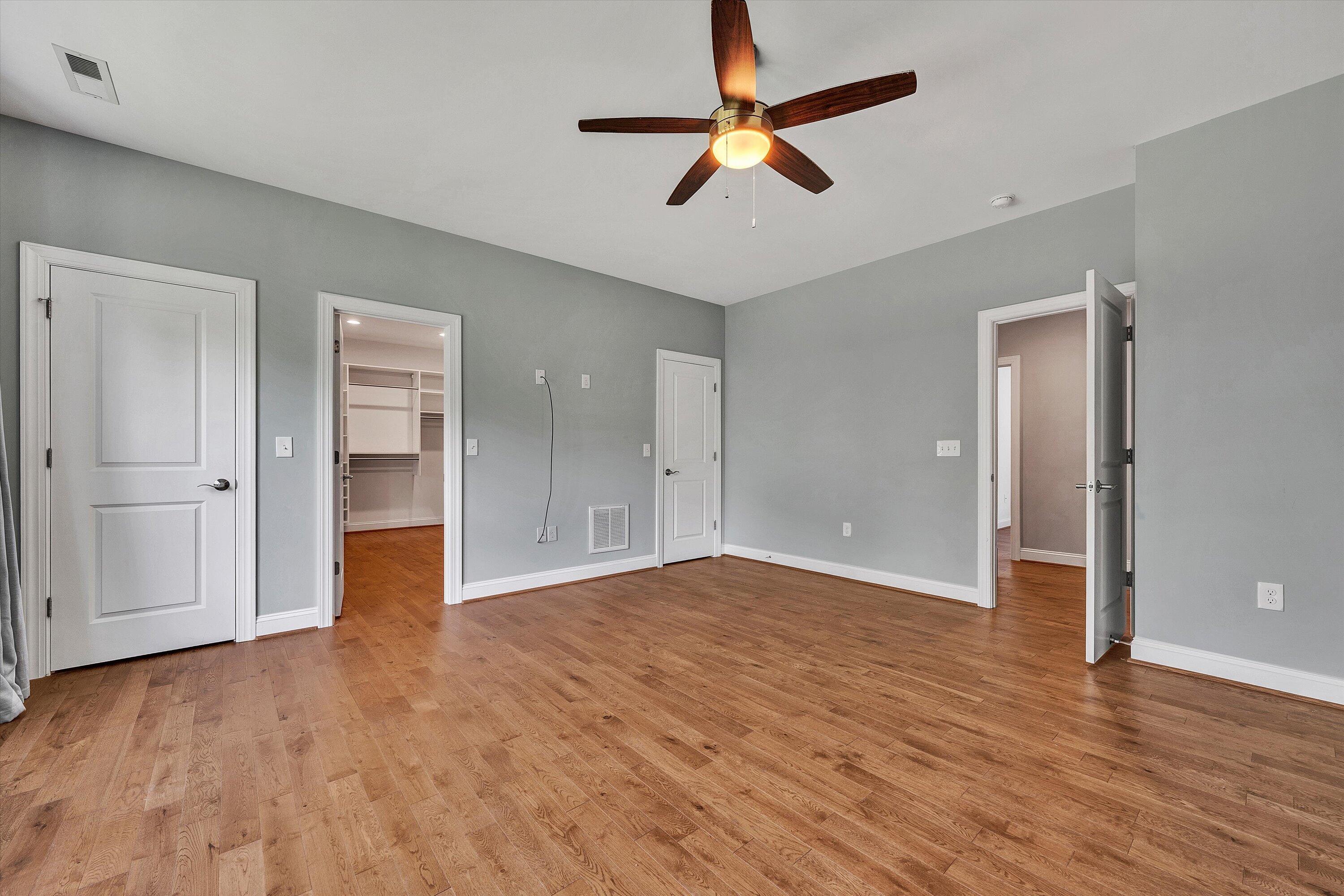 6981 Fairway Ridge Road Salem, VA 24153 - Photo 26 of 53 wooden floor in an empty room with a ceiling fan