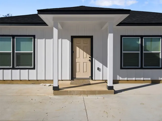 an aerial view of residential house with outdoor space