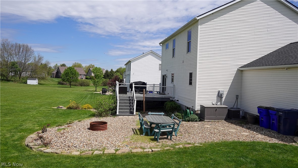 4849 Edson Road Kent, OH 44240 - Photo 9 of 50 View of yard featuring a deck and a fire pit