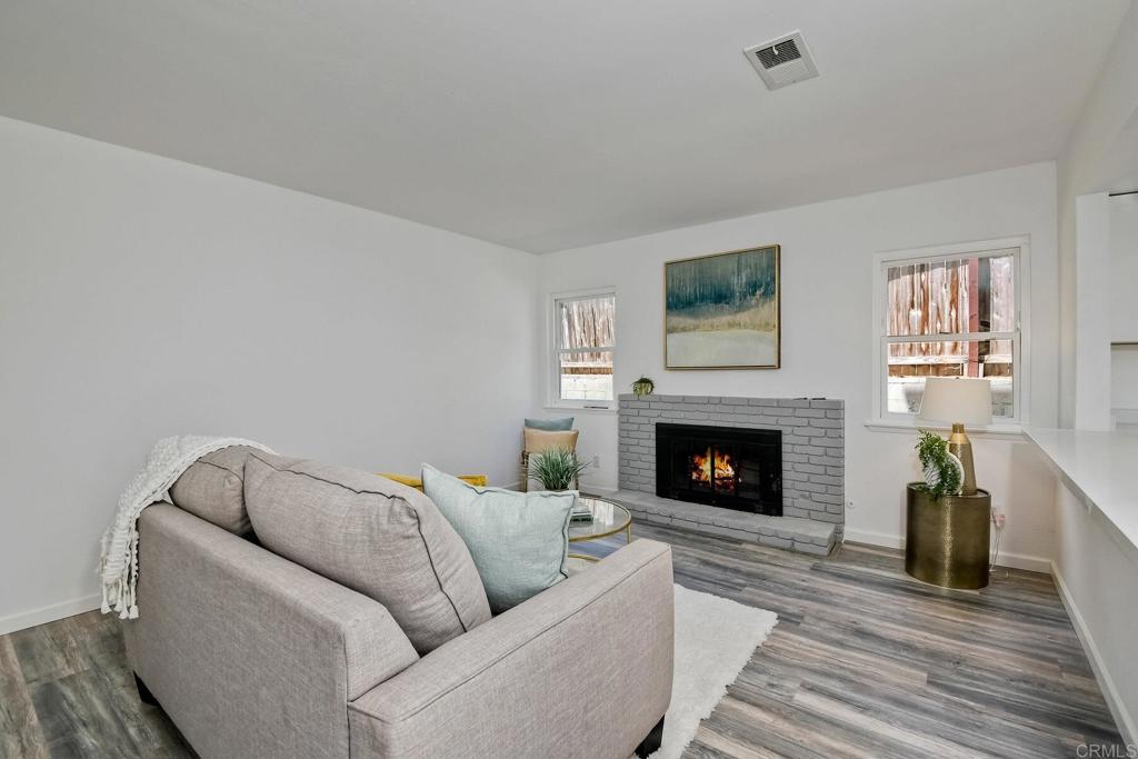 3106 Morningside Drive Oceanside, CA 92056 - Photo 12 of 38 a living room with furniture and a fireplace