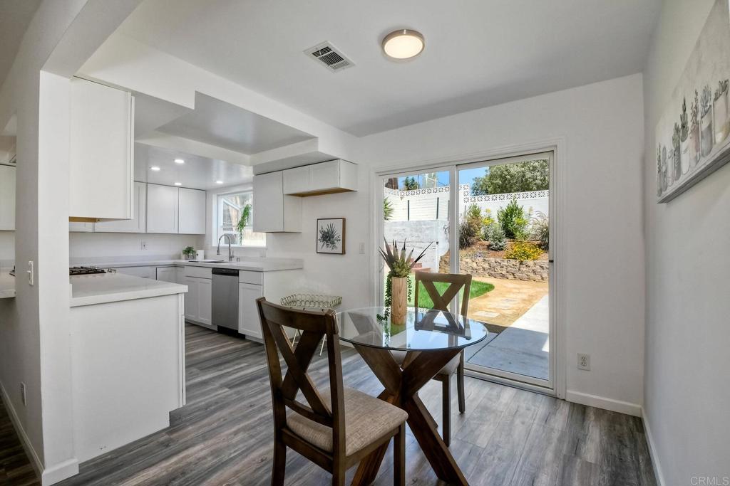 3106 Morningside Drive Oceanside, CA 92056 - Photo 15 of 38 a view of a dining room with furniture and wooden floor
