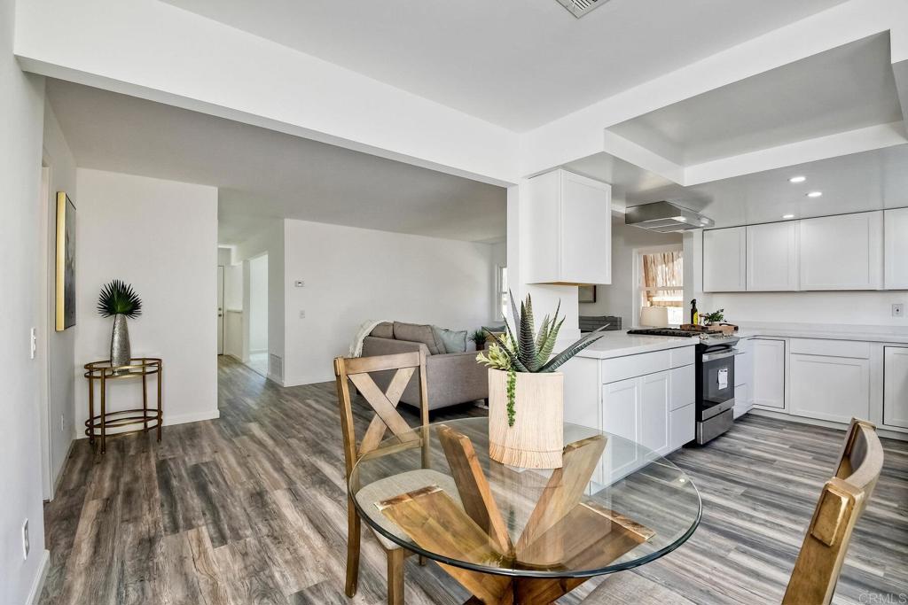 3106 Morningside Drive Oceanside, CA 92056 - Photo 17 of 38 a kitchen with sink dining table and chairs