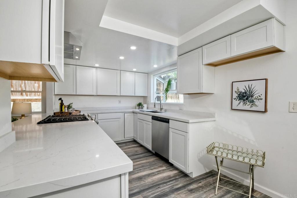 3106 Morningside Drive Oceanside, CA 92056 - Photo 19 of 38 a kitchen with a stove and white cabinets