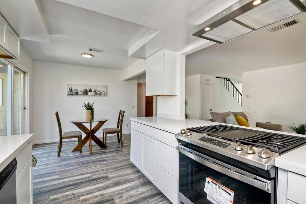 3106 Morningside Drive Oceanside, CA 92056 - Photo 21 of 38 a kitchen with a stove and white cabinets