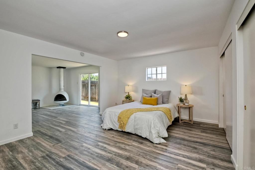 3106 Morningside Drive Oceanside, CA 92056 - Photo 23 of 38 a bedroom with a bed and a large window