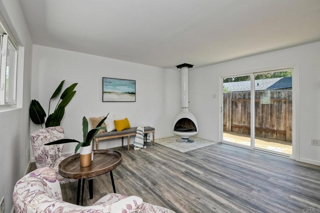3106 Morningside Drive Oceanside, CA 92056 - Photo 26 of 38 a living room with furniture a rug and a large window