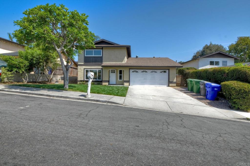 3106 Morningside Drive Oceanside, CA 92056 - Photo 3 of 38 a front view of a house with a yard and garage