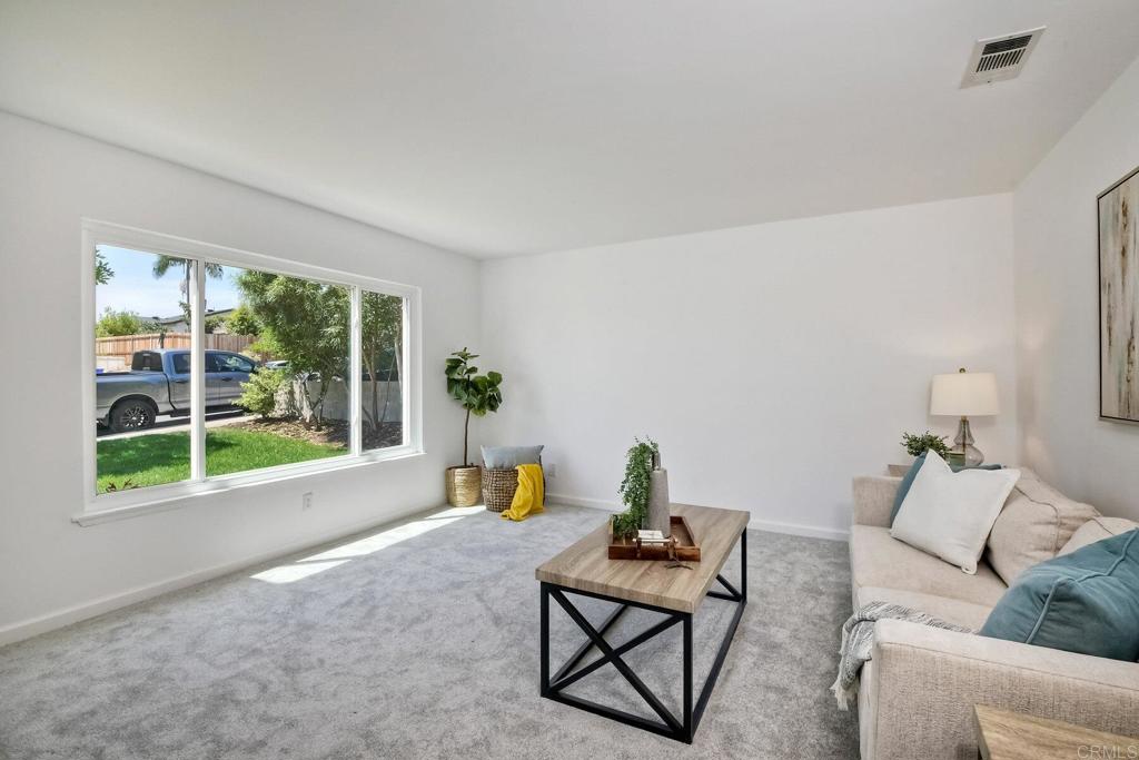 3106 Morningside Drive Oceanside, CA 92056 - Photo 6 of 38 a living room with furniture and a large window