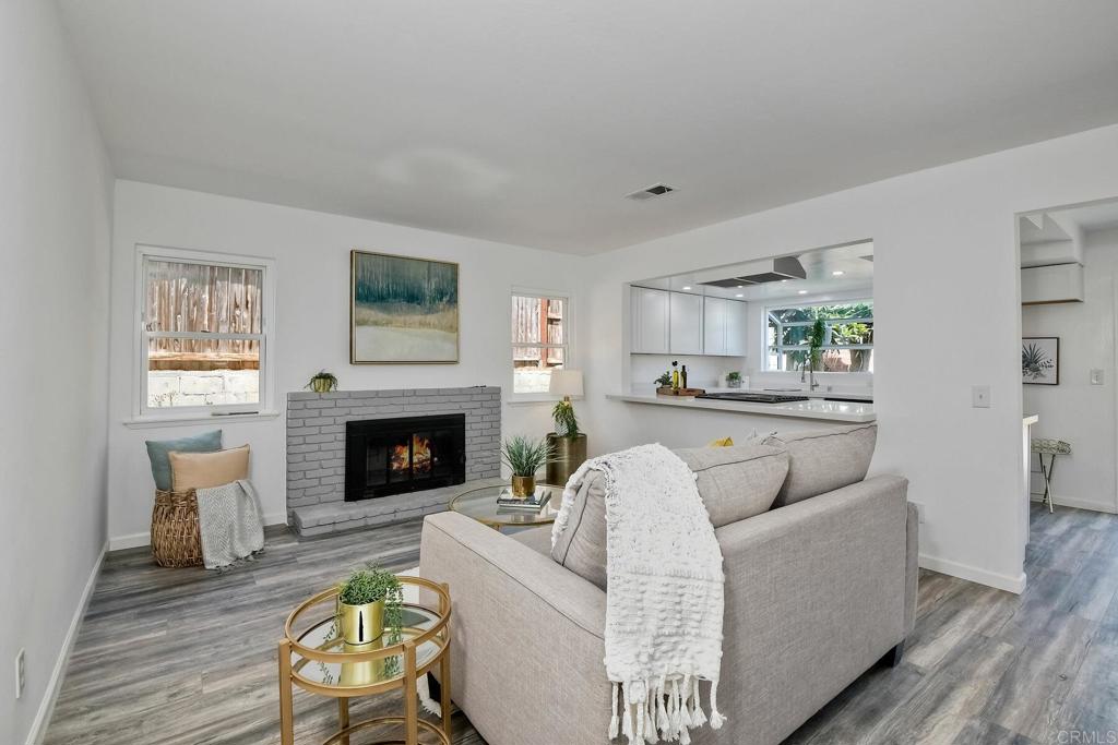 3106 Morningside Drive Oceanside, CA 92056 - Photo 10 of 38 a living room with furniture and a fireplace