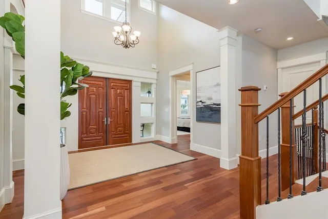 a kitchen with stainless steel appliances granite countertop a refrigerator sink and stove