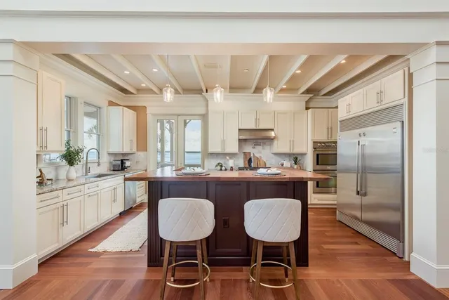 a bathroom with a toilet sink vanity and mirror