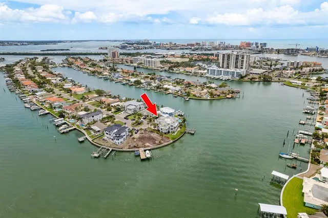 a front view of a residential houses with yard and green space