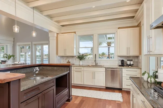 a spacious bedroom with a large bed and a large window