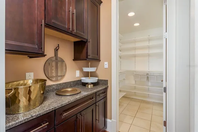 a bathroom with a sink vanity and a mirror