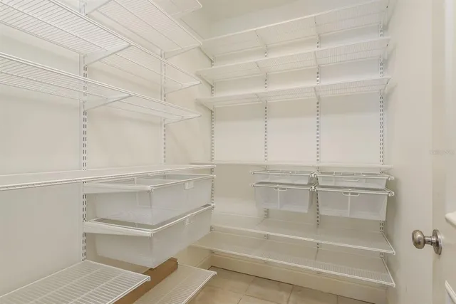 a living room filled with furniture and a potted plant