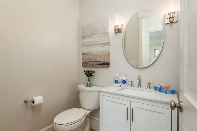 a bathroom with a double vanity sink and mirror