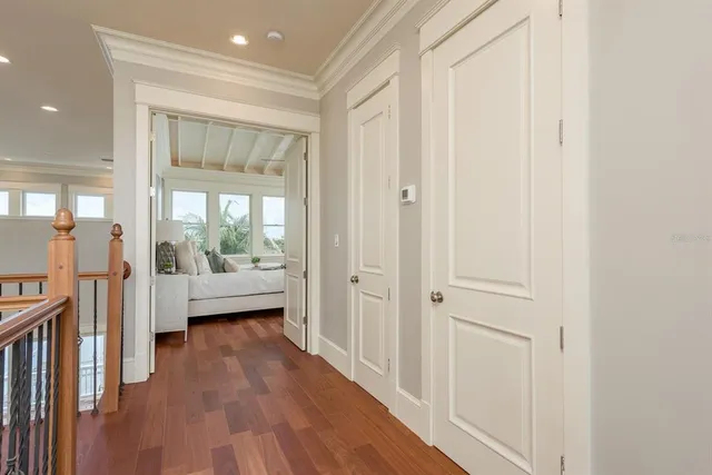 a view of a balcony with wooden floor and lake view