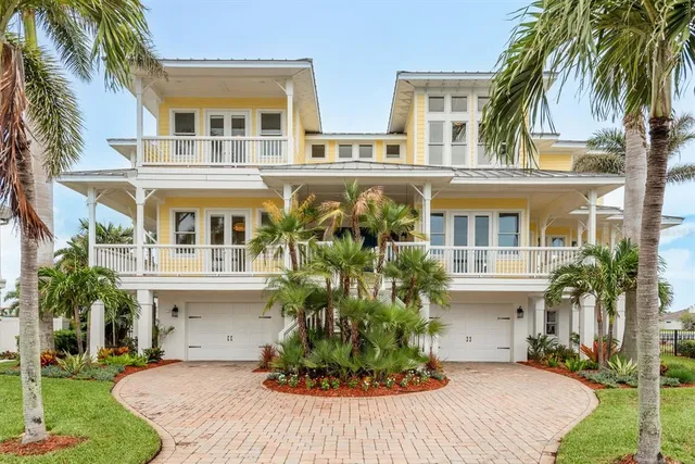 a hallway with wooden floor and a potted plant