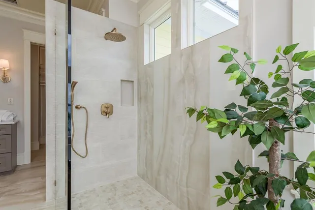 a view of a house with backyard and trees