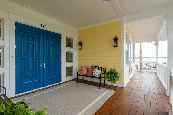 a view of an entryway wooden floor and staircase