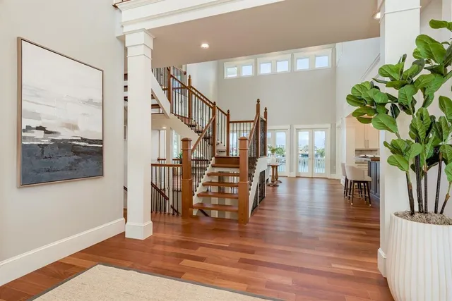 a kitchen with stainless steel appliances granite countertop a sink a stove and cabinets